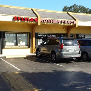 a car parked in front of the store