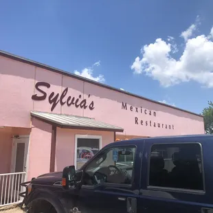 a truck parked in front of the restaurant
