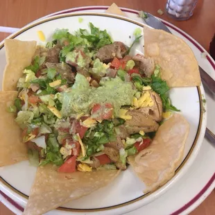 Large guacamole salad with any meat, fajita chicken or fajita beef or ground beef or shredded chicken. Yum!
