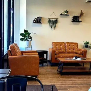 Comfy seating with a fireplace.