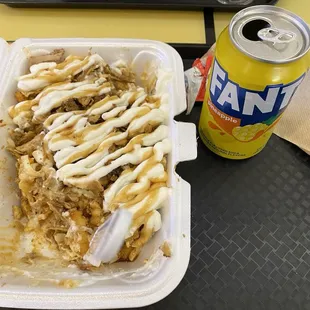Loaded fries and a pineapple Fanta. It&apos;s a miracle I had the presence of mind to stop and take a photo.