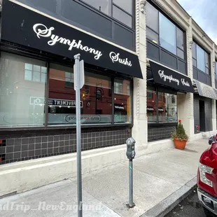 a red truck parked in front of a restaurant