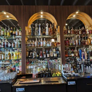 a bar with a lot of liquor bottles