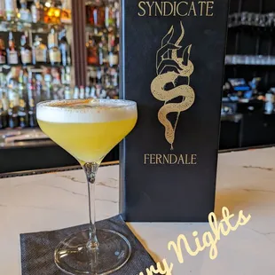 a cocktail in a coupe glass