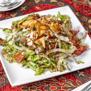a plate of salad on a table