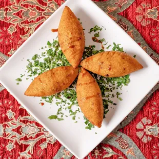 a white plate with three pieces of bread on it