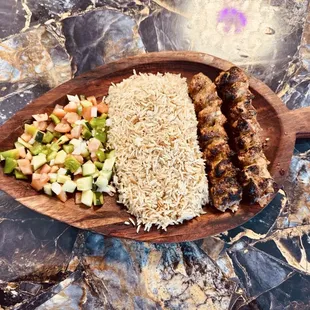 Chicken kabab with rice and salad. Delicious.