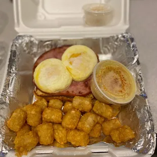 Wisconsin Benedict. Replaced English muffin with French toast. Side of "smashed tots" and honey cinnamon butter