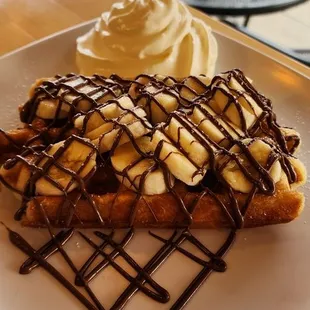 a dessert with bananas and whipped cream