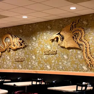 a dragon and a dragon head on the wall