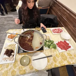 Half &amp; half hot pot. Lamb, beef, mushrooms, bok Choy, fish balls, bamboo