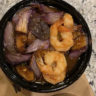a bowl of shrimp and onions