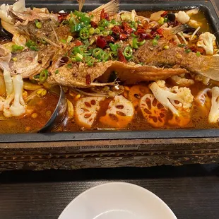 a pan of fish and vegetables