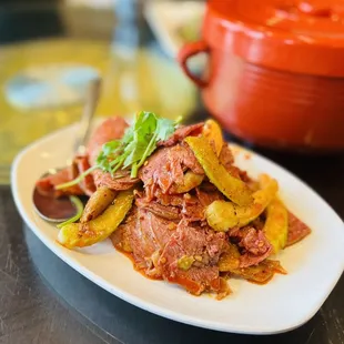 a plate of meat and vegetables