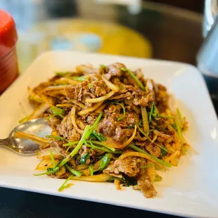 a plate of stir fried food