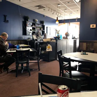 a man sitting at a table in a restaurant