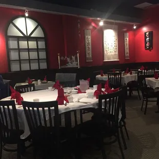 a dining room with red walls