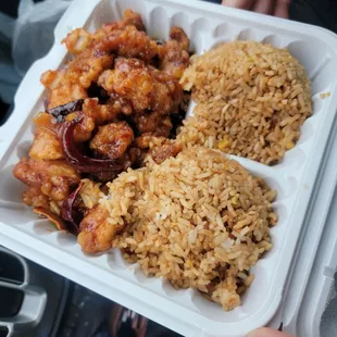 General tso chicken and fried rice with an egg roll