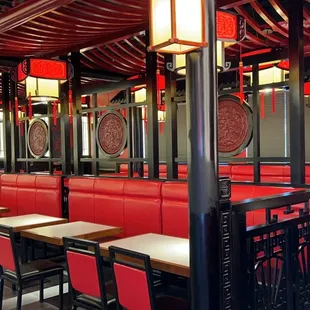 a restaurant with red booths