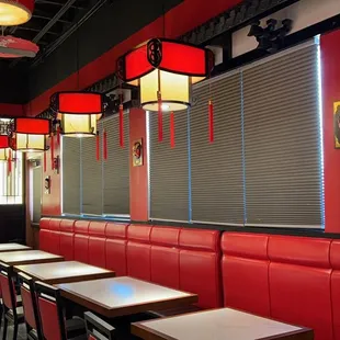 a restaurant with red booths