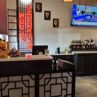 a bar with a television in the background