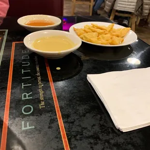 a bowl of soup and a bowl of fries