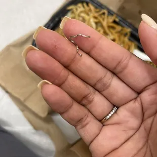 I ate half the food before I found this. Gross. Wtf is this. Thank goodness I didn't chew it.