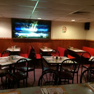 a restaurant with tables and chairs