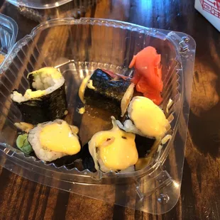 sushi in a plastic container
