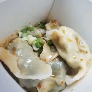 Vegetable dumplings in spicy sauce