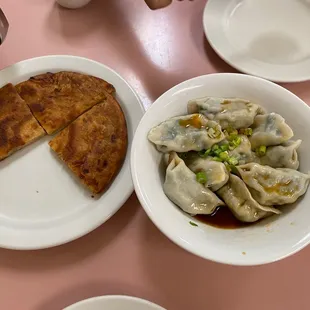 Scallion pancake and vegetable dumpling in spicy sauce