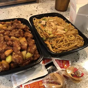 Cashew chicken and chicken chow menu with a side of rice for the cashew chicken. Each container could feed two adults.