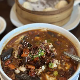 Spicy frog legs. The soup is spicy &amp; good, I wish the frog legs were not cut up in little pieces. We ate too much bones.