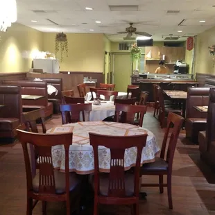 a restaurant with tables and booths