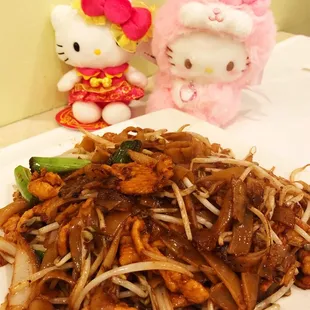 a plate of noodles and meat