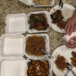 Sesame chicken, lo mein noodles, beef with ginger scallion and scallion pancakes.