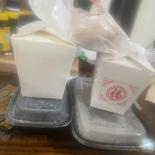 two plastic containers with food in them