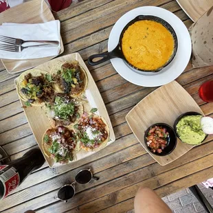 Chips, queso, salsa, barbocoa tacos, carnitas tacos