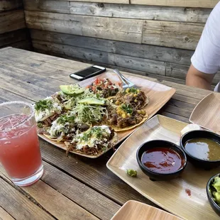 Barbacoa, pollo, steak, and carnitas tacos.. salsa trio, pomegranate juicy margarita