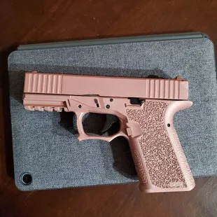Rose gold Cerakote Glock 19.