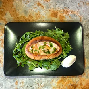 One of our most popular breakfast dishes. Egg, ham, scallions baked stuffed bread with arugula salad!!!