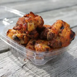 chicken wings in a plastic container