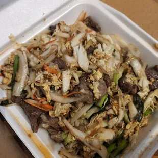 beef and vegetables in a styrofoam container