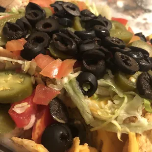 Chicken nachos loaded with extra veggies! Yum! Enough for 2 meals.
