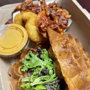 a waffle sandwich with a side salad