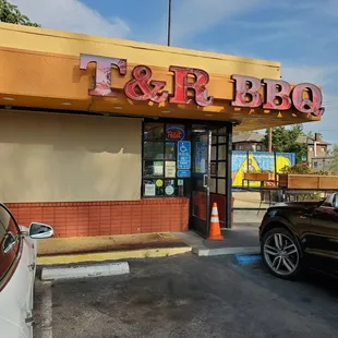 a car parked in front of a restaurant