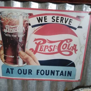 a pepsi cola sign