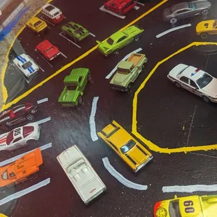 Our table.  Fun, with matchbox cars under glass.