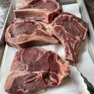 steaks on a baking sheet