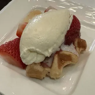 Waffles, strawberries and whipped cream.